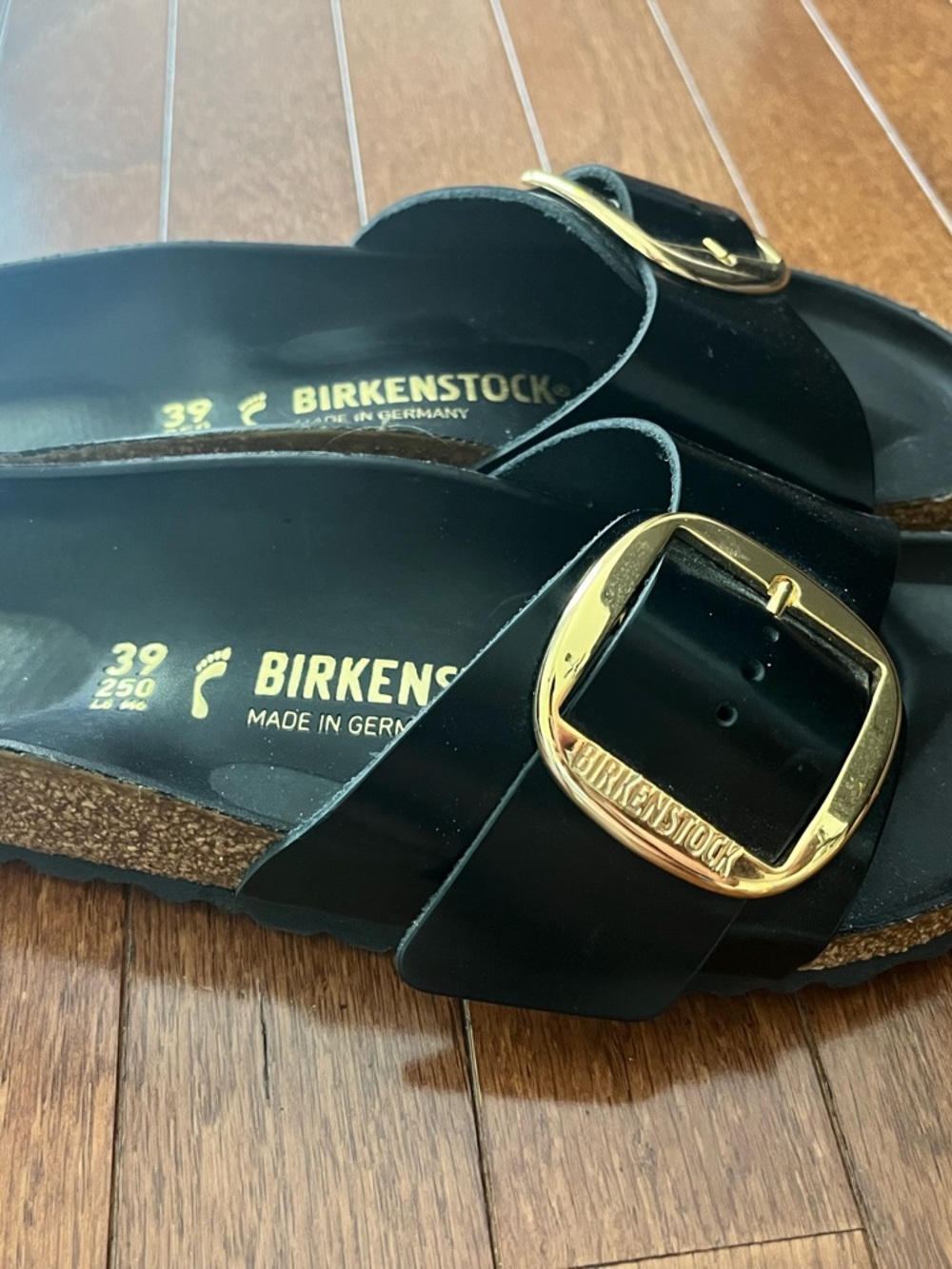 Birkenstock Black Single-Strap Sandals with Gold Buckles - Picture 2 of 5